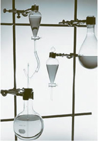 Traditional chemistry lab equipment consisted of glass beakers,
      clamps, and tubing.