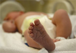 Fotografia do pé de um recém-nascido.